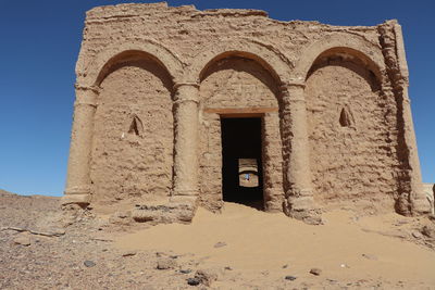 Low angle view of old building against clear sky