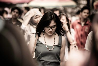 Young woman standing in park