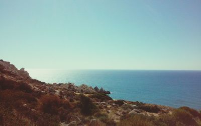Scenic view of sea against clear blue sky
