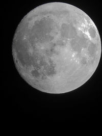Low angle view of moon against sky at night