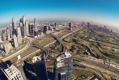 High angle view of city buildings against sky