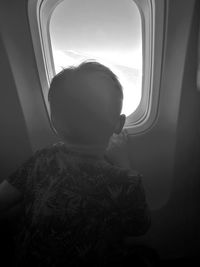 Boy sitting in airplane