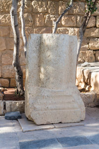 Stone sculpture against wall