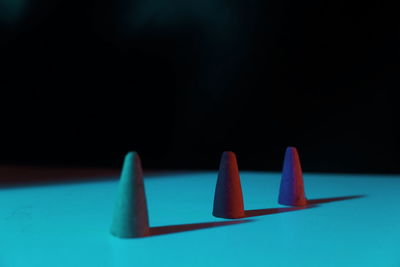 Close-up of papers on table against black background