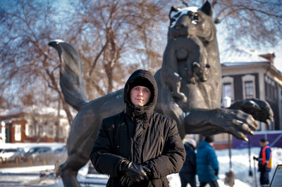 Statue of woman in snow