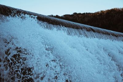 Scenic view of snow covered landscape against clear sky