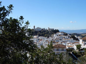 High angle view of townscape against clear blue sky