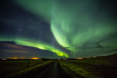 Scenic view of road against sky at night