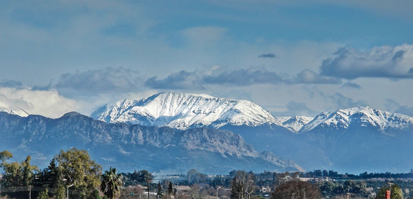 Panoramic shot of snowcapped mountains against sky