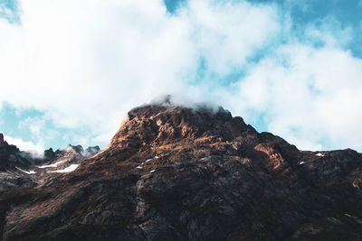 Low angle view of rock formation against sky