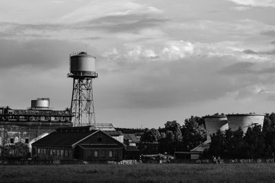 Built structure on field against sky