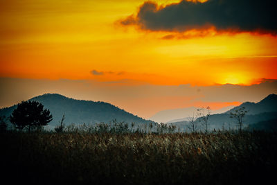 Scenic view of silhouette landscape against sky during sunset