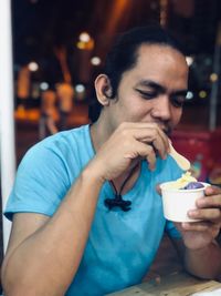 Portrait of man drinking coffee