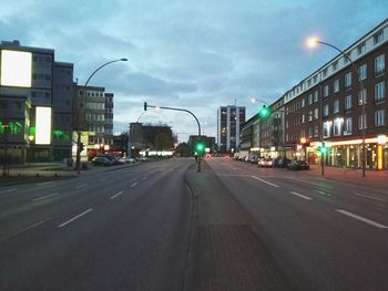 City street against cloudy sky