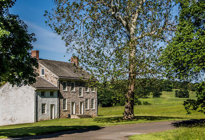 House by empty road and trees at valley forge national historical park