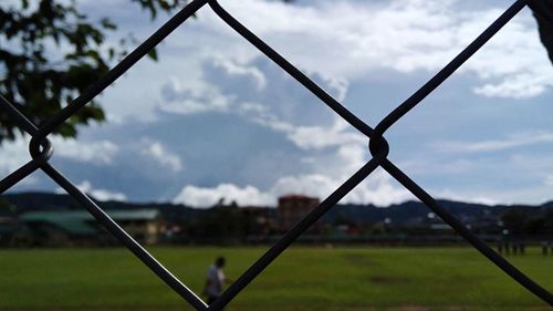 Man on field against sky