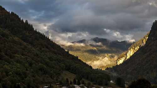 Scenic view of mountains against sky at sunset