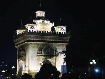 Low angle view of illuminated building at night