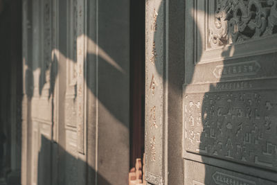 Low section of man standing against wall