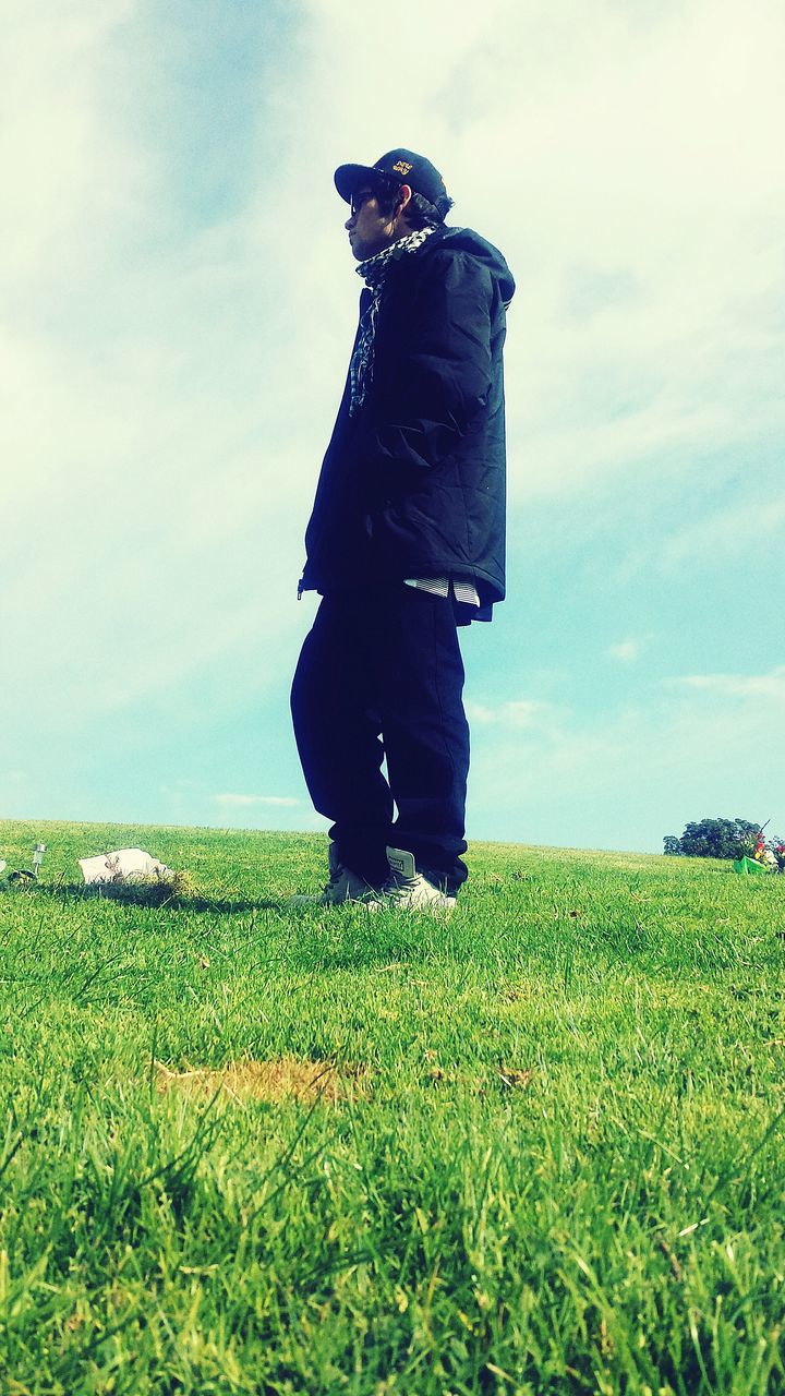 field, grass, sky, lifestyles, leisure activity, standing, landscape, rear view, men, plant, casual clothing, growth, full length, nature, communication, green color, grassy, cloud - sky