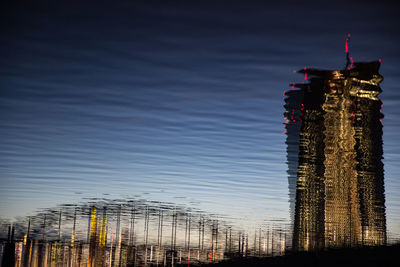 Low angle view of illuminated buildings against sky