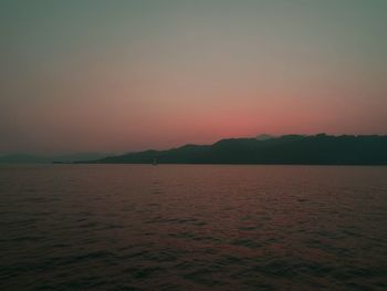 Scenic view of river at sunset