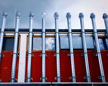 Low angle view of factory against sky