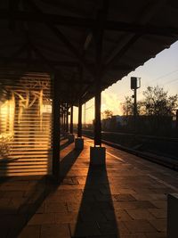 Bridge in city during sunset