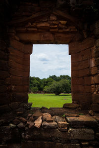 View of arched wall through window
