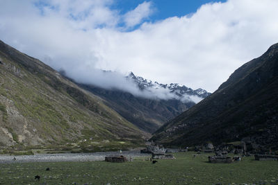 Scenic view of snowcapped mountains against sky