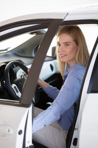 Close-up of woman sitting car