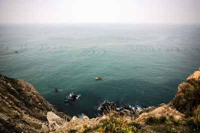 Scenic view of rock formation in sea