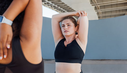 Young woman exercising in gym