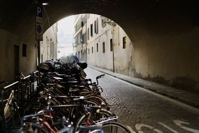 Bicycles parked on street by old building