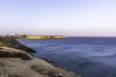 Scenic view of sea against clear sky