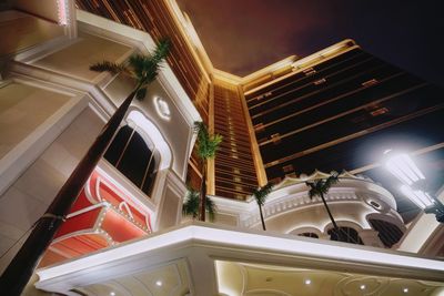 Low angle view of illuminated building at night