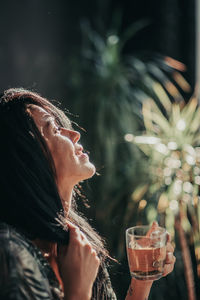 Portrait of a woman drinking water