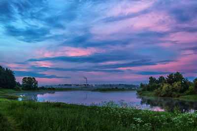 Scenic view of landscape against sky at sunset