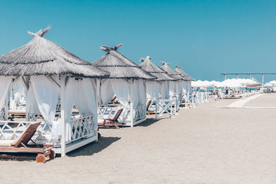 Panoramic view of beach against clear sky