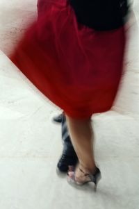 Close-up of woman sitting on wall