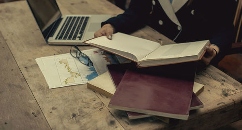 High angle view of man using laptop on table
