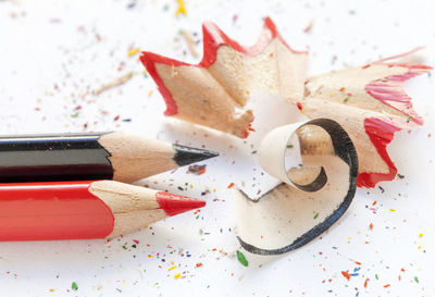 High angle view of multi colored pencils and shavings on table