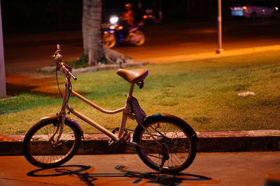 Bicycle parked against wall