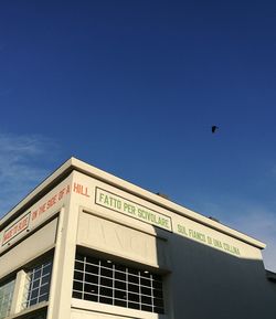 Low angle view of building against blue sky