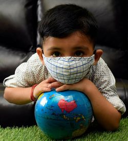 Portrait of boy sitting outdoors