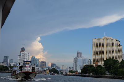 Modern buildings in city against sky