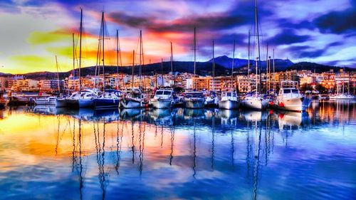 Boats moored at harbor