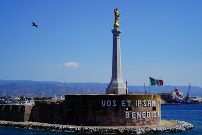 View of information sign against the sky