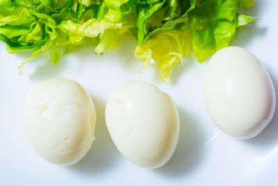 High angle view of eggs in plate