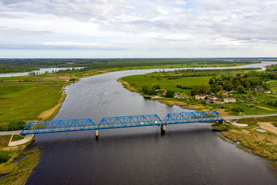 Aerial panoramic view from above to the bridge over the river lielupe near kalnciems, latvia